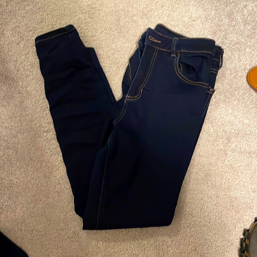 Miss poured in blue dark wash skinny jeans